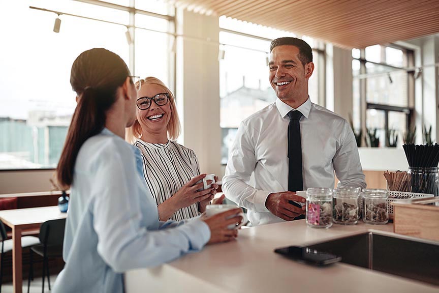 Office coworkers enjoying aromatic coffee together